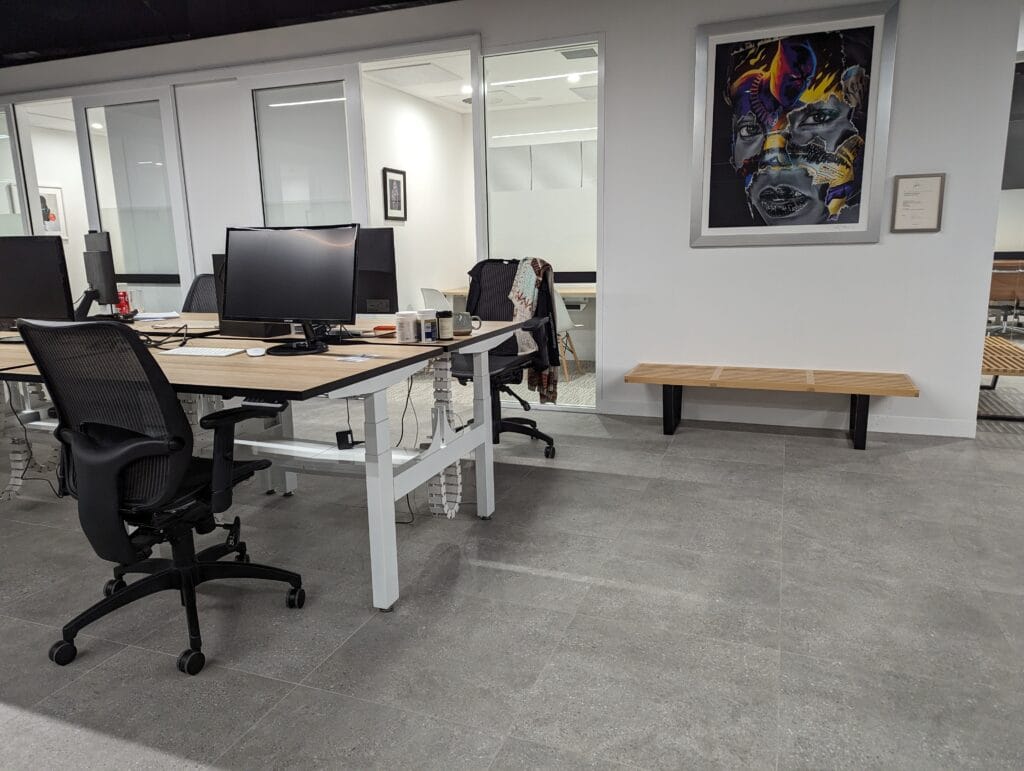 Standing desk workstations with cable management in a production setting