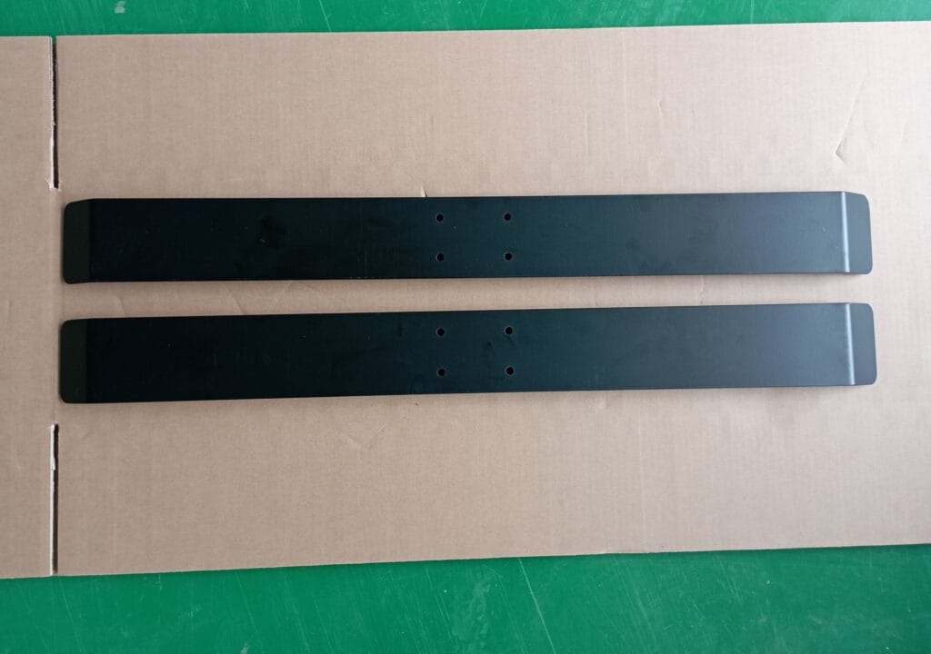 Four inspection photographs showing chipped paint on components identified for replacement in the Goodmans order